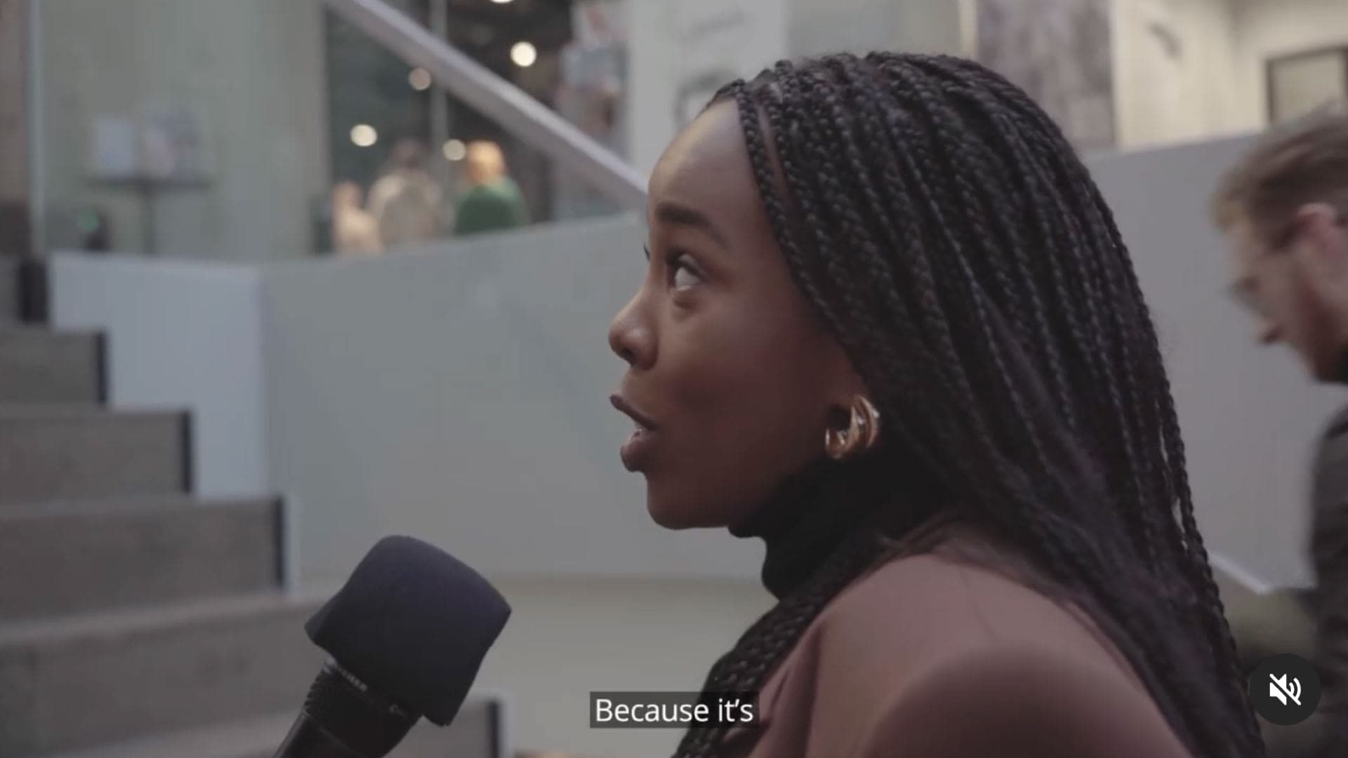 Young woman answering a street interview for Deloitte Luxembourg
